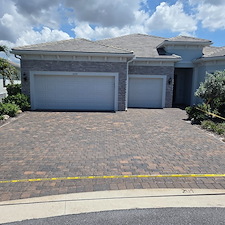 Exterior-maintenance-performed-on-this-home-in-the-Beachwalk-Community-of-Englewood-started-with-a-softwash-of-the-house-and-cage-as-well-as-driveway-and-pool-deck-paver-sealing 3