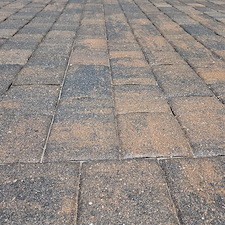 Exterior-maintenance-performed-on-this-home-in-the-Beachwalk-Community-of-Englewood-started-with-a-softwash-of-the-house-and-cage-as-well-as-driveway-and-pool-deck-paver-sealing 1