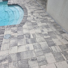 Paver-raising-and-leveling-repair-job-along-with-a-wash-and-seal-on-the-paver-poold-deck 0