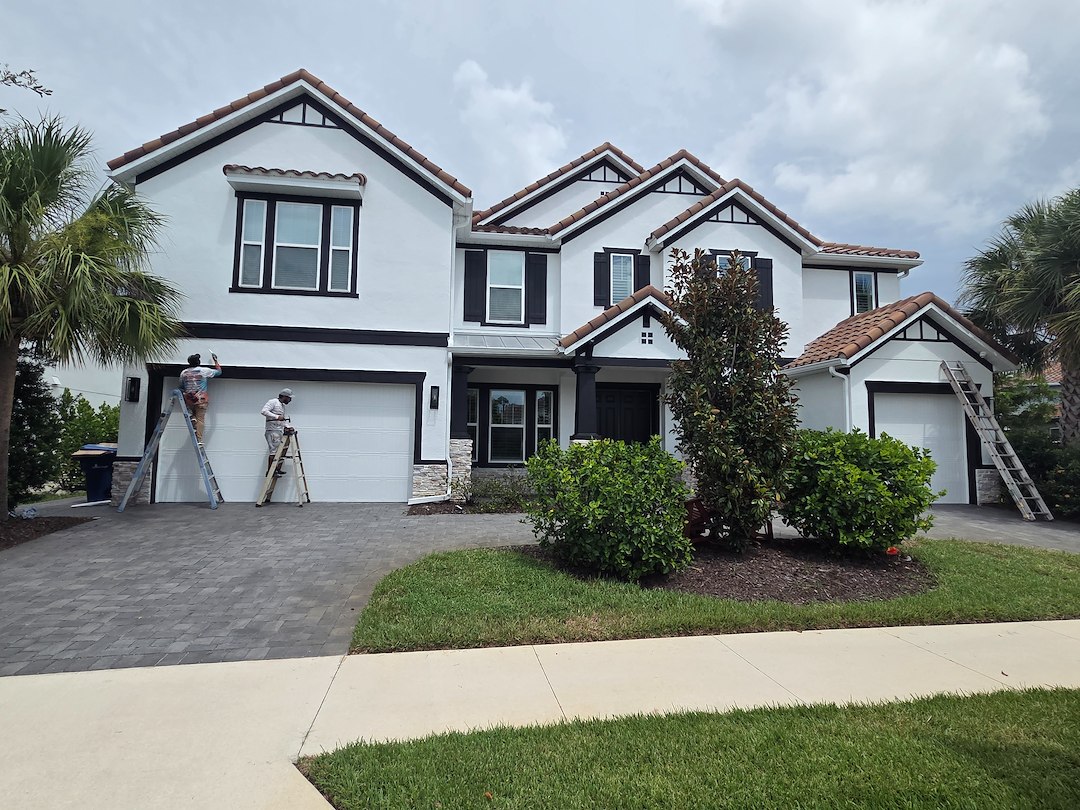 This complete exterior painting on a 2 story with White body and black trim in the Heron Landing Community turned out beautiful 