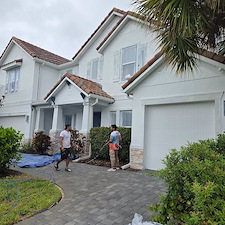 This-complete-exterior-painting-on-a-2-story-with-White-body-and-black-trim-in-the-Heron-Landing-Community-turned-out-beautiful 0