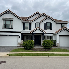 This-complete-exterior-painting-on-a-2-story-with-White-body-and-black-trim-in-the-Heron-Landing-Community-turned-out-beautiful 7
