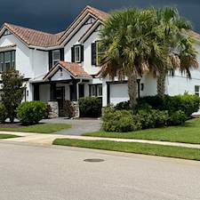 This-complete-exterior-painting-on-a-2-story-with-White-body-and-black-trim-in-the-Heron-Landing-Community-turned-out-beautiful 6