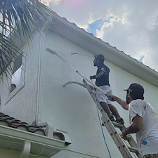 This-complete-exterior-painting-on-a-2-story-with-White-body-and-black-trim-in-the-Heron-Landing-Community-turned-out-beautiful 4