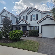 This-complete-exterior-painting-on-a-2-story-with-White-body-and-black-trim-in-the-Heron-Landing-Community-turned-out-beautiful 3