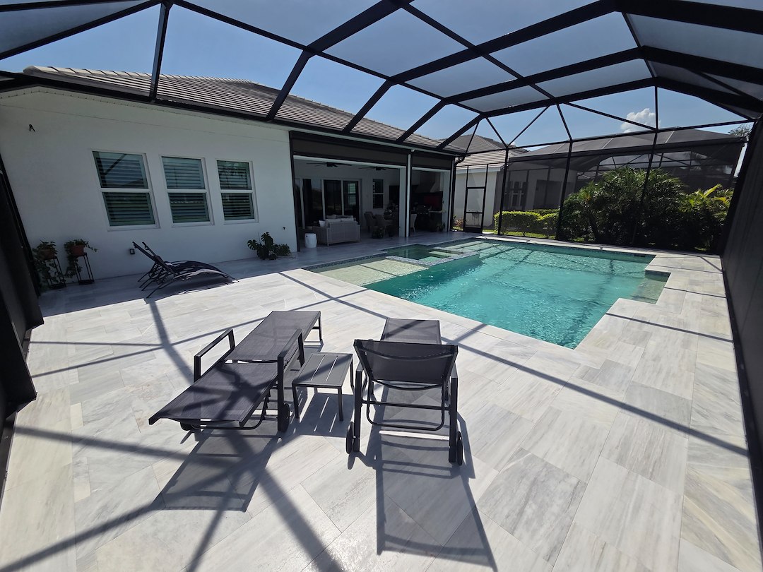 This new customer in The Isles of Lakewood Ranch got the VIP Soft wash on house and pool cage, Paver Driveway sealed and beautiful Marble Tile Pool Deck Repaired and Restored. Thumbnail