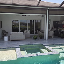 This-new-customer-in-The-Isles-of-Lakewood-Ranch-got-the-VIP-Soft-wash-on-house-and-pool-cage-Paver-Driveway-sealed-and-beautiful-Marble-Tile-Pool-Deck-Repaired-and-Restored 2