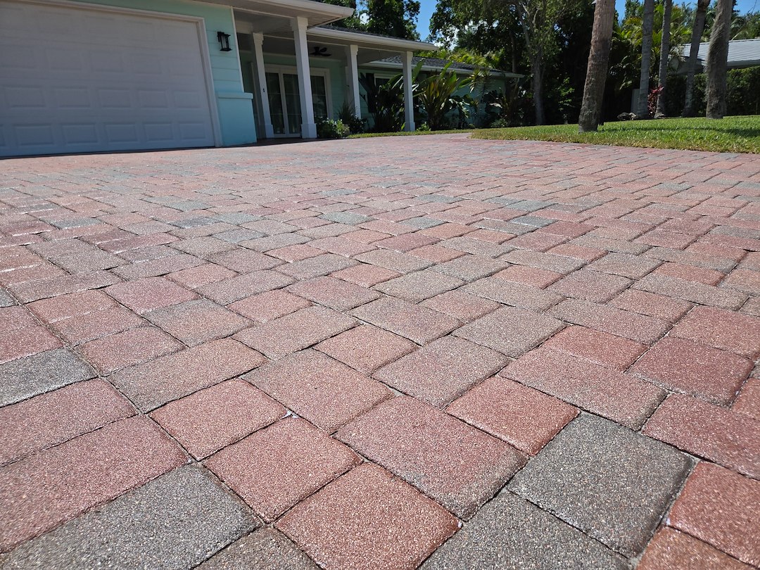 This paver driveway and pool deck project near Sarasota Bay was overdue for a deep clean and sealing.  Thumbnail