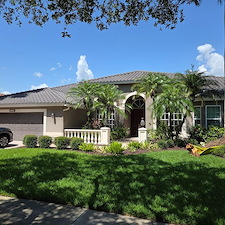 Wet-look-travertine-pool-deck-and-house-soft-wash-in-Naples-FL 0