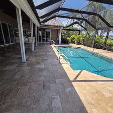 Wet-look-travertine-pool-deck-and-house-soft-wash-in-Naples-FL 3