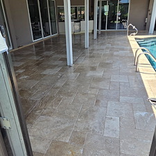 Wet-look-travertine-pool-deck-and-house-soft-wash-in-Naples-FL 2